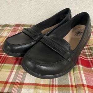 Women’s Clark’s black slip on shoes.